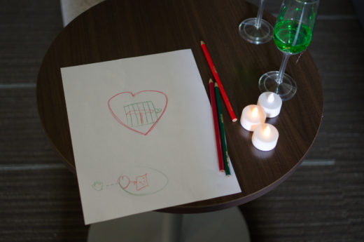 paper with hand written symbols including heart and cage
