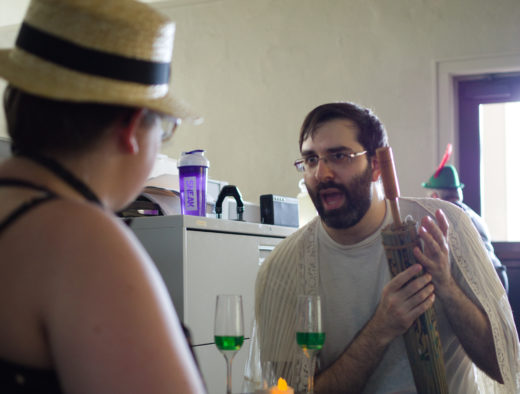 two people in headed discussion over green drinks