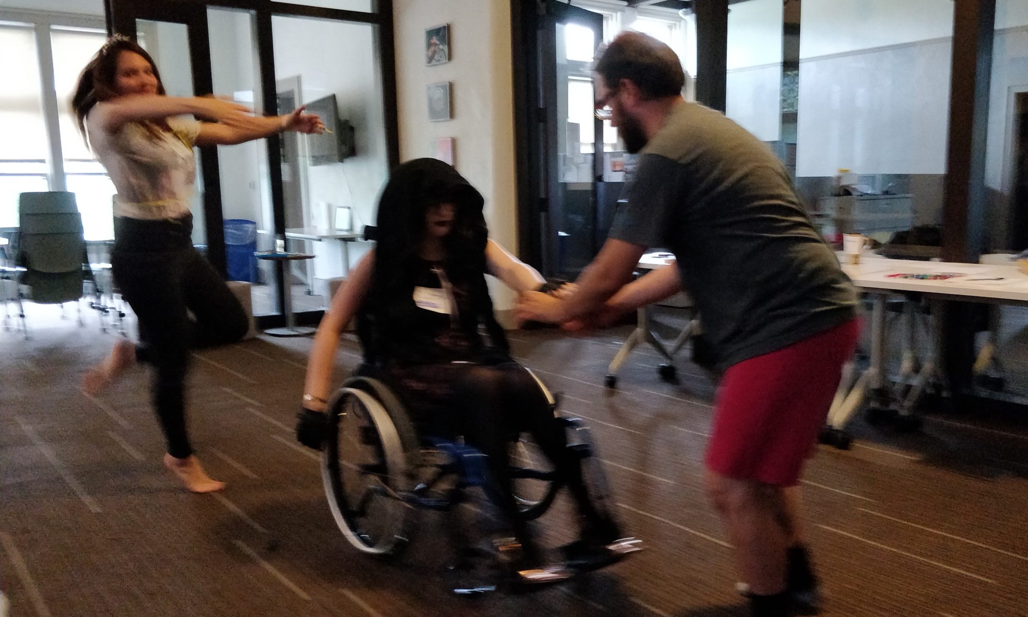 several people dancing, one in wheelchair