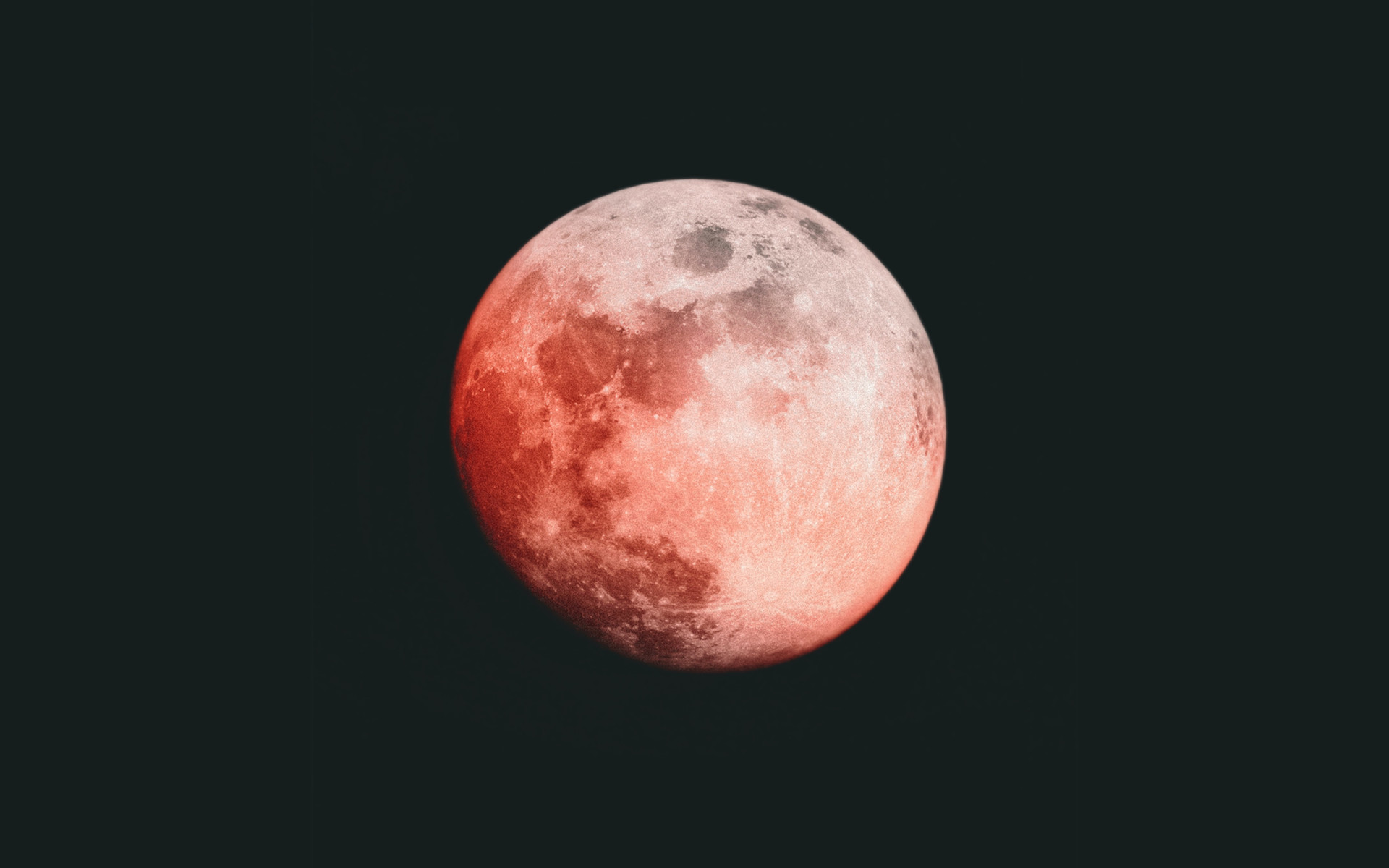 a red-tinted full moon